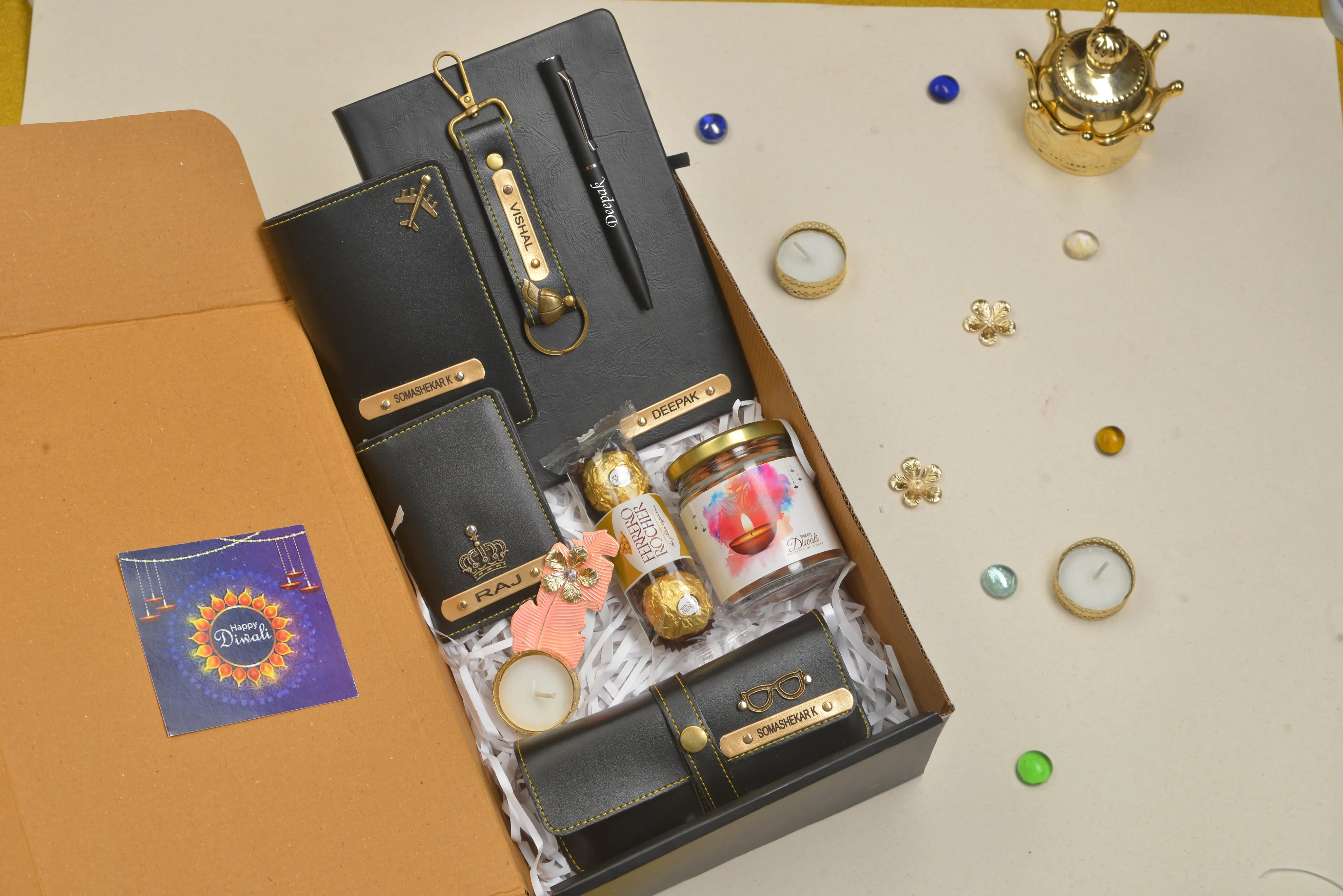2024 Diwali Combo 5.0 (Classy Hardcover Diary   Faux Leather Keychain with Hook    Faux Leather Passport Cover    Faux Leather Eyewear   Unisex Sleek Wallet   Ferrero Rocher   Diya   Dryfruit Jar  Classic Metal Pen) - Black