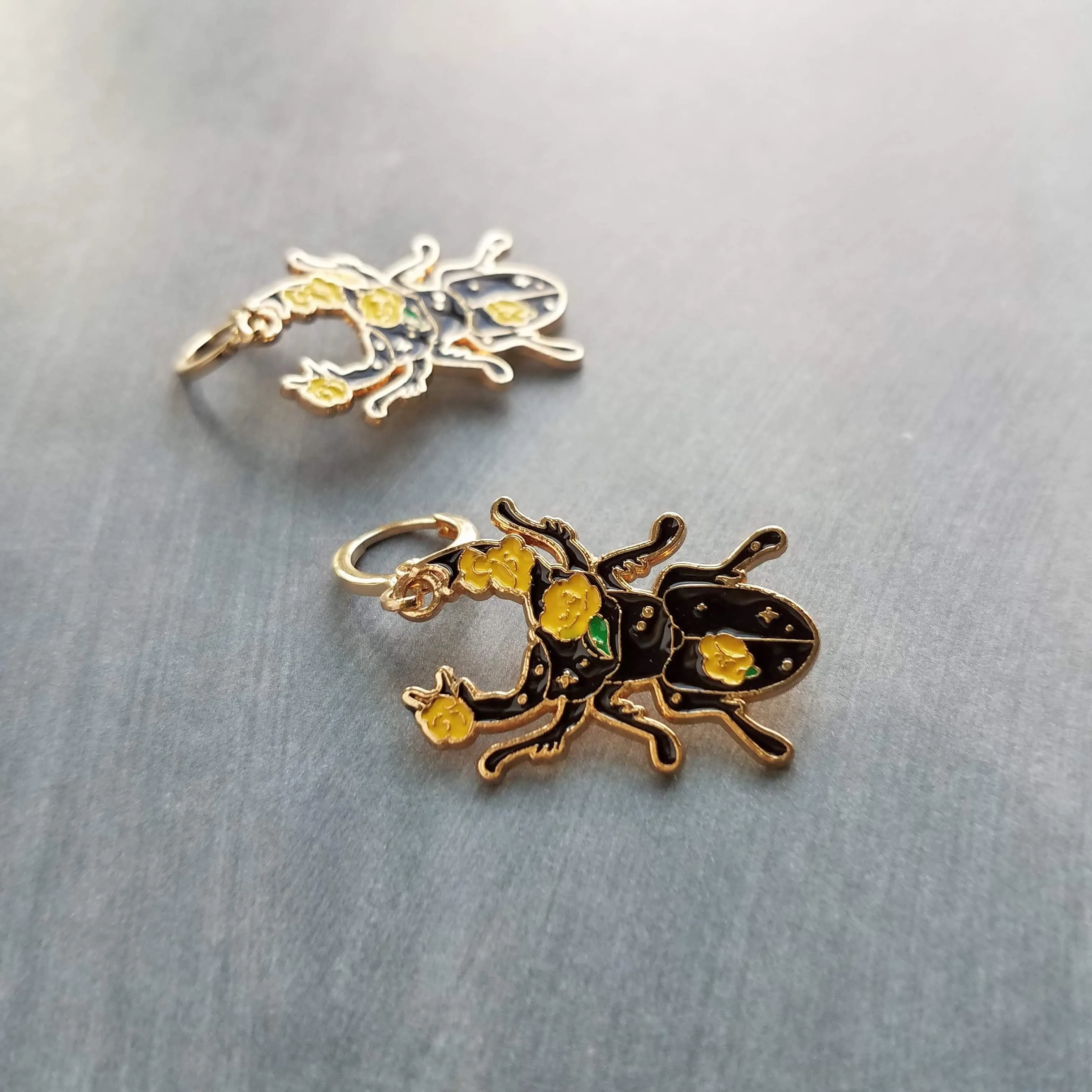 Black Beetle Earrings, stag horn beetle, beetle jewelry, gold huggie hoop, yellow flowers on beetle, insect jewelry, black enamel bug