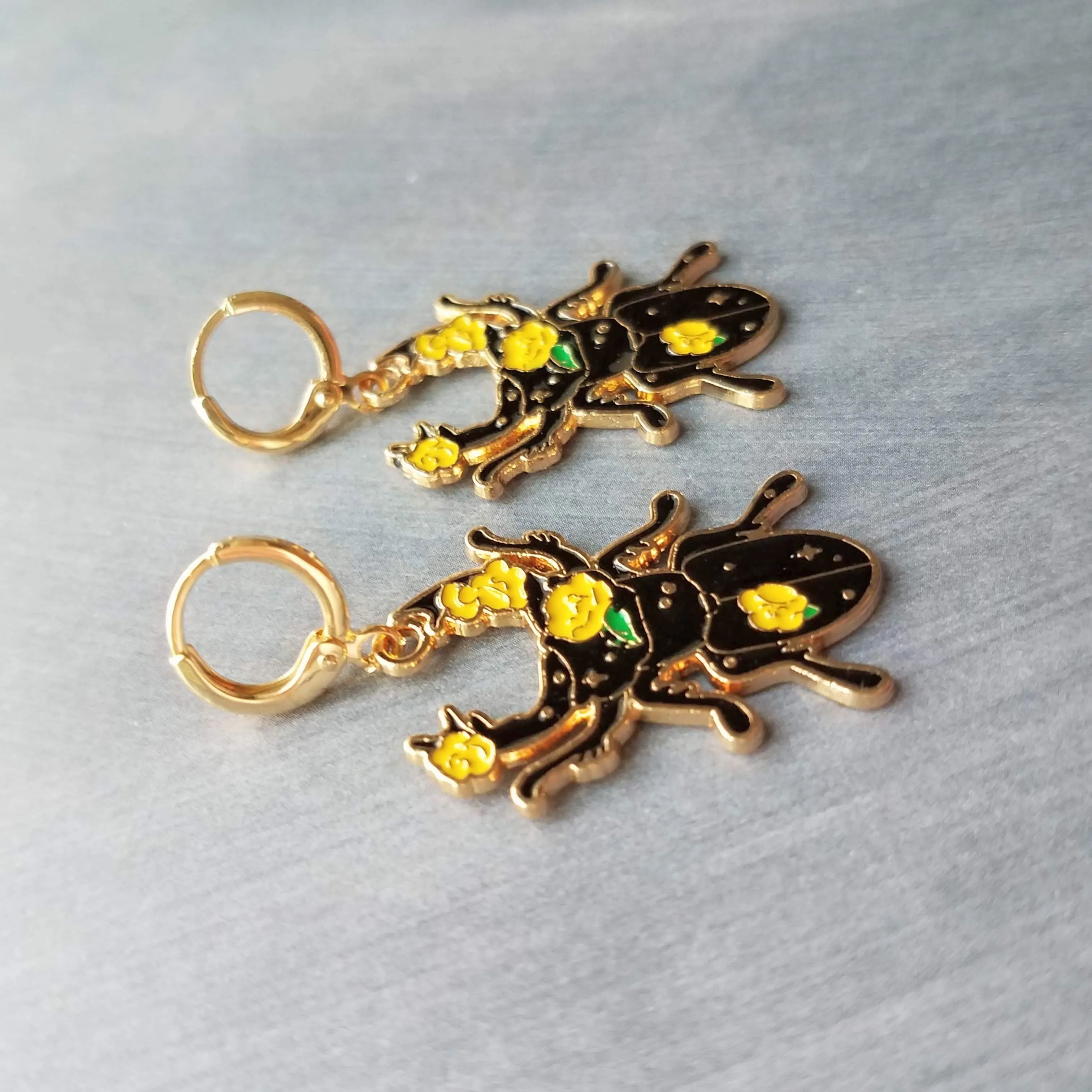 Black Beetle Earrings, stag horn beetle, beetle jewelry, gold huggie hoop, yellow flowers on beetle, insect jewelry, black enamel bug