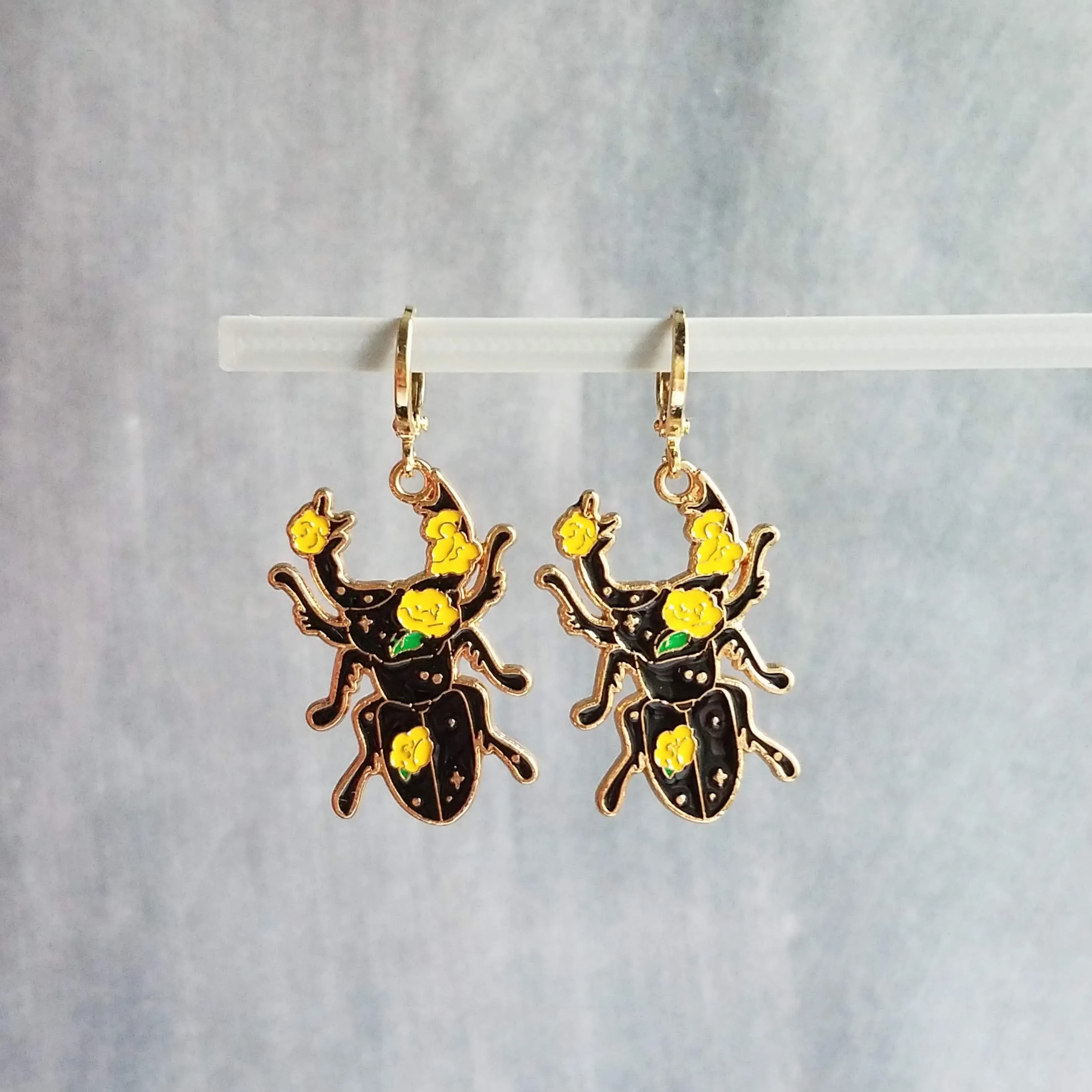 Black Beetle Earrings, stag horn beetle, beetle jewelry, gold huggie hoop, yellow flowers on beetle, insect jewelry, black enamel bug