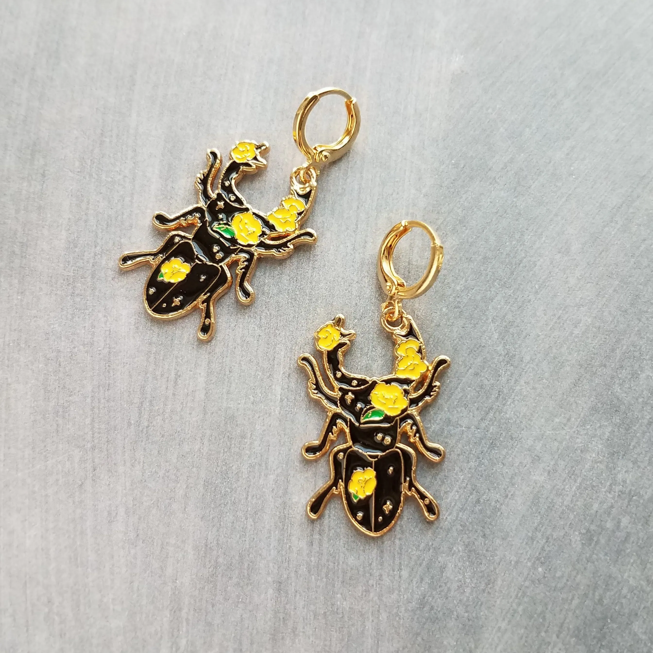 Black Beetle Earrings, stag horn beetle, beetle jewelry, gold huggie hoop, yellow flowers on beetle, insect jewelry, black enamel bug